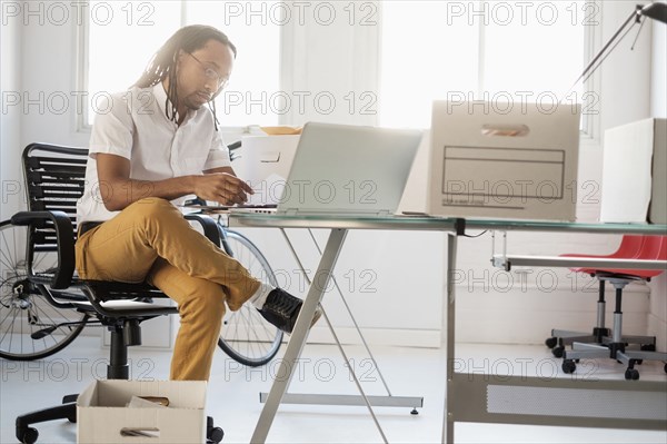 Black businessman working in new office