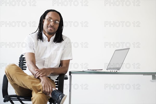 Black businessman smiling in office