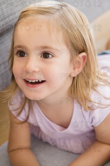 Caucasian girl laying on floor