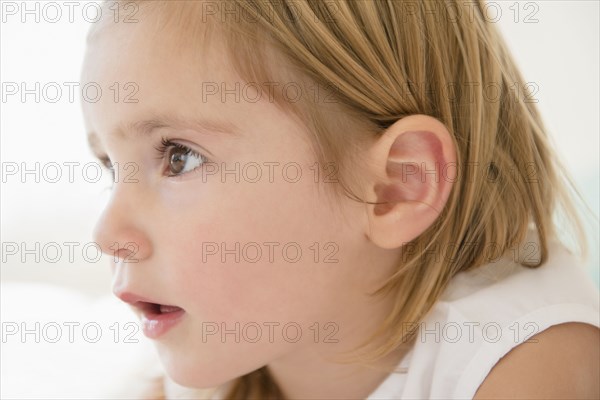 Surprised Caucasian girl staring