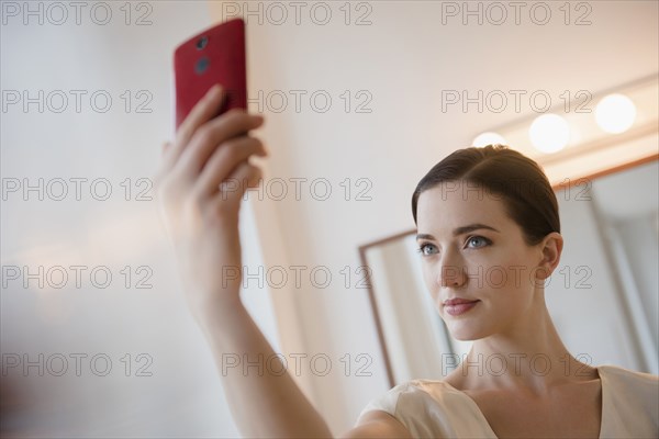 Caucasian woman taking selfie