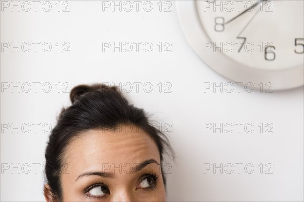 Woman looking at clock