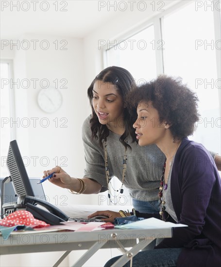 Businesswoman working in office together