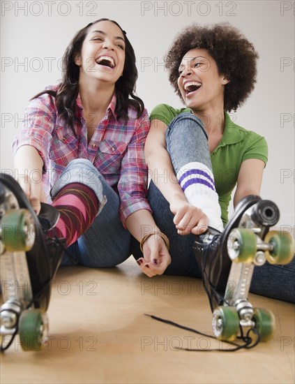 Friends putting on roller skates