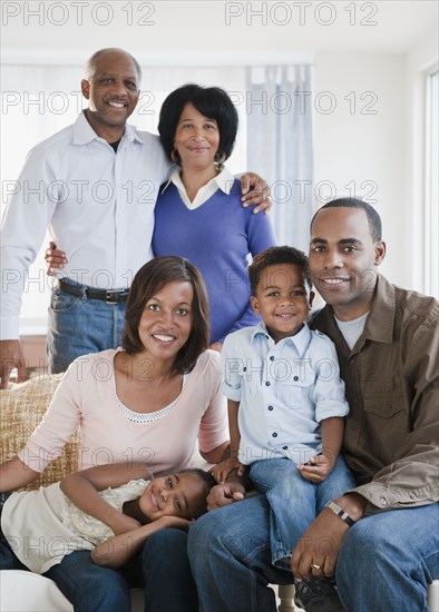 African American family sitting in living room