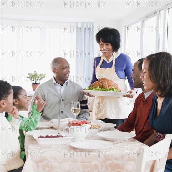 African American family about to enjoy Thanksgiving dinner