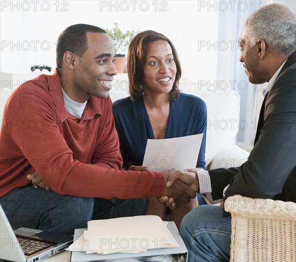 African American couple talking with financial advisor