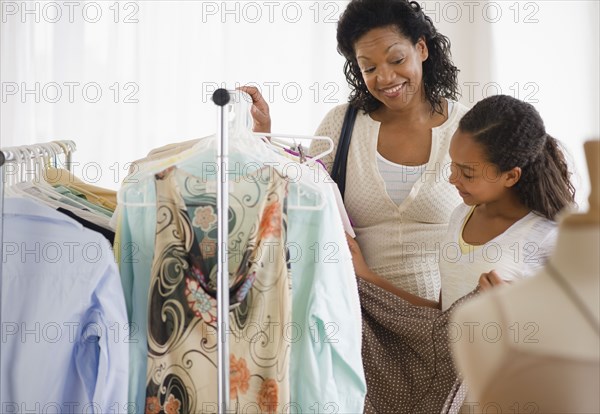 Mother and daughter shopping for clothing together