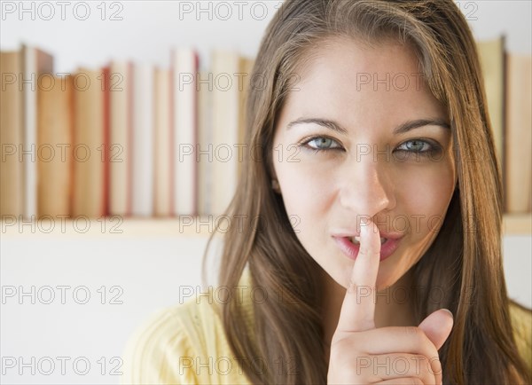 Indian woman making 'shhh' gesture