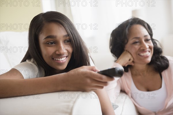Mother and daughter watching television
