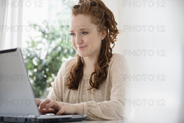 Caucasian woman using laptop