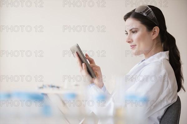 Caucasian scientist using digital tablet