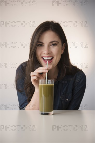 Caucasian Woman Drinking Green Smoothie With Straw Photo12 Tetra