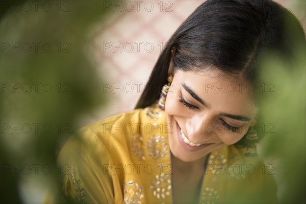 Smiling Indian woman looking down