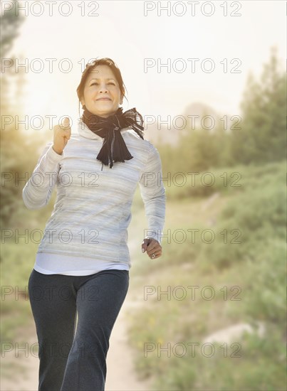 Hispanic woman running on trail