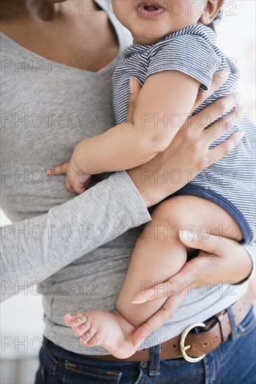 Mother holding baby son