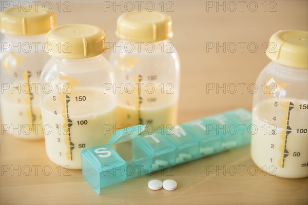 Pill box and bottles of breast milk