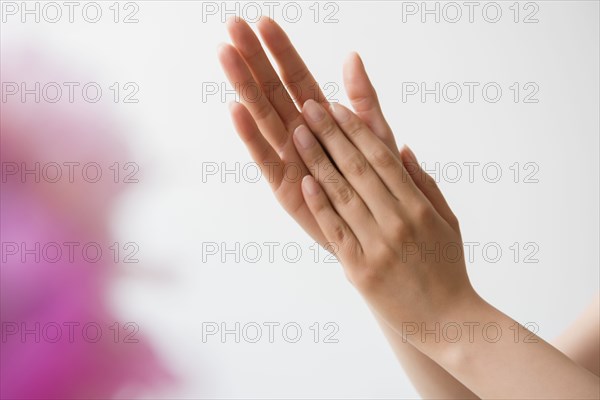 Hispanic woman rubbing hands