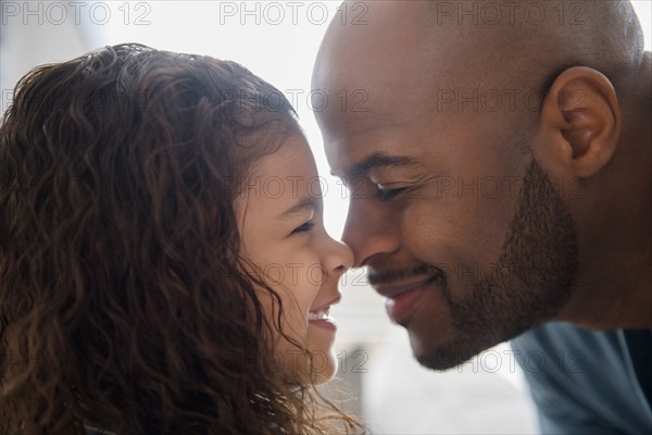 Father and daughter rubbing noses