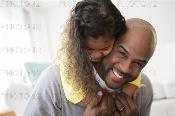 Daughter hugging father