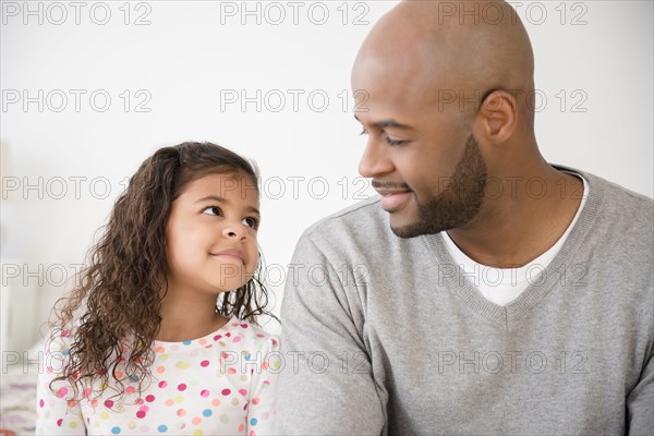 Father and daughter smiling