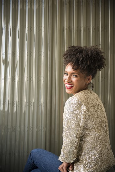 Glamorous Black woman looking over shoulder