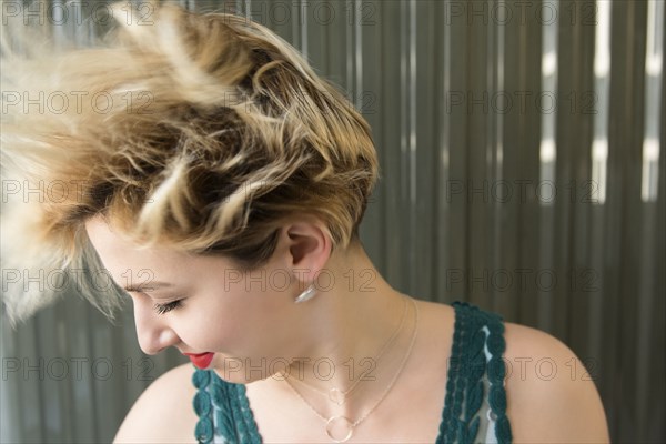 Caucasian woman tossing hair