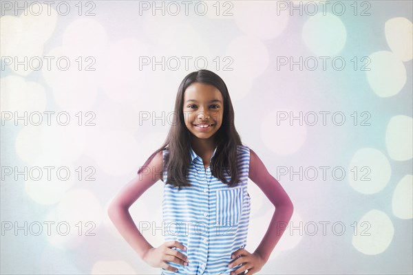 Smiling Mixed Race girl posing