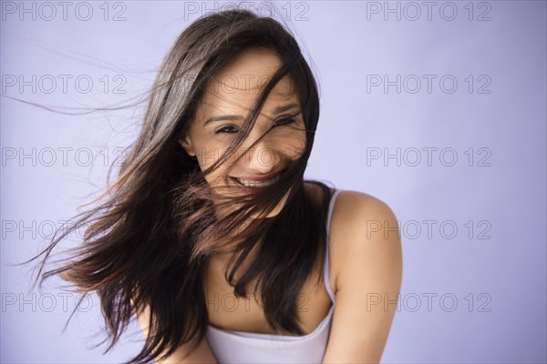 Hair of Mixed Race woman blowing in wind