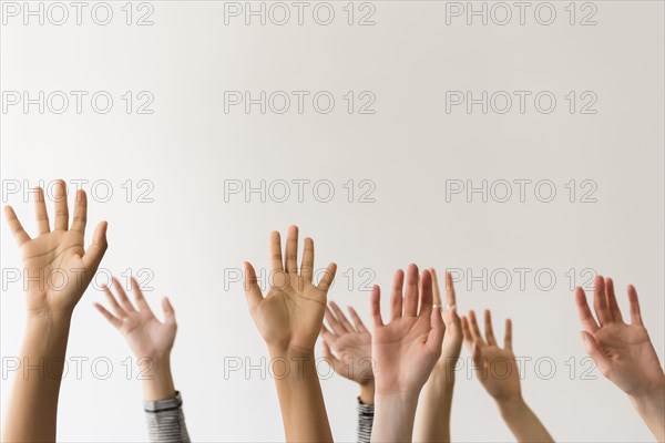 Raised hands of women