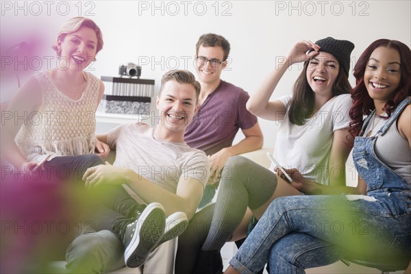 Portrait of smiling friends in livingroom