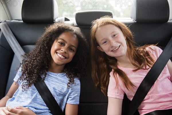 Portrait of smiling girls in car