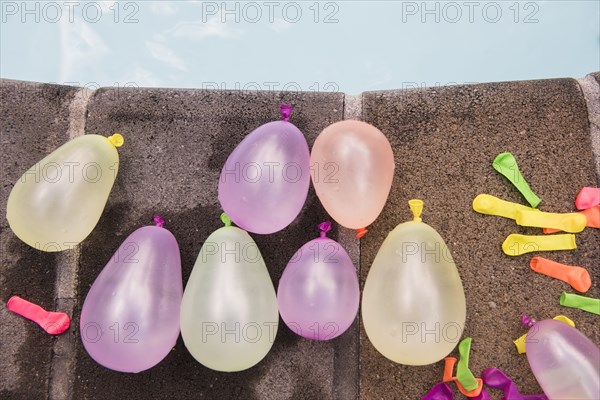 Water balloons at the edge of swimming pool