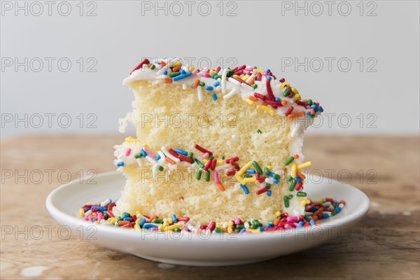 Slice of cake with sprinkles on plate
