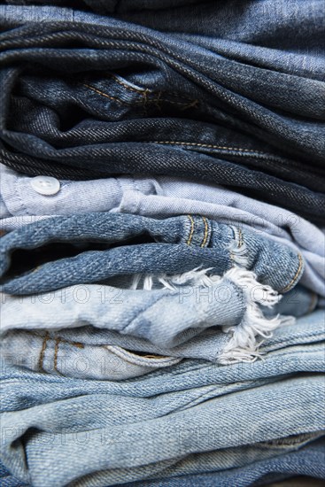 Stack of folded blue jeans