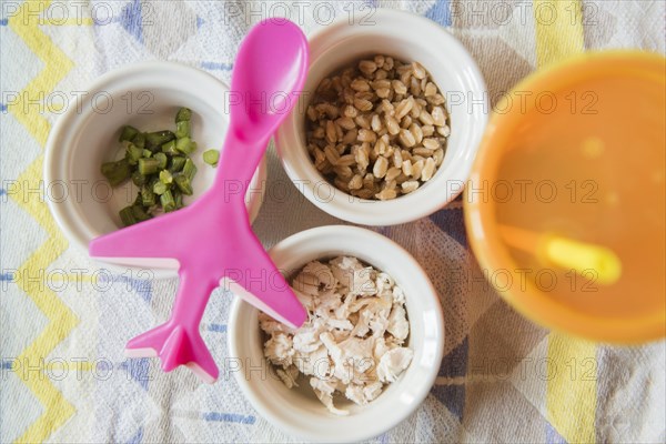 Airplane spoon on bowls of baby food
