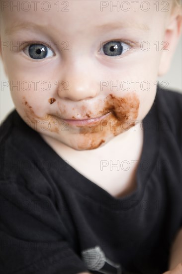 Caucasian baby boy with messy face