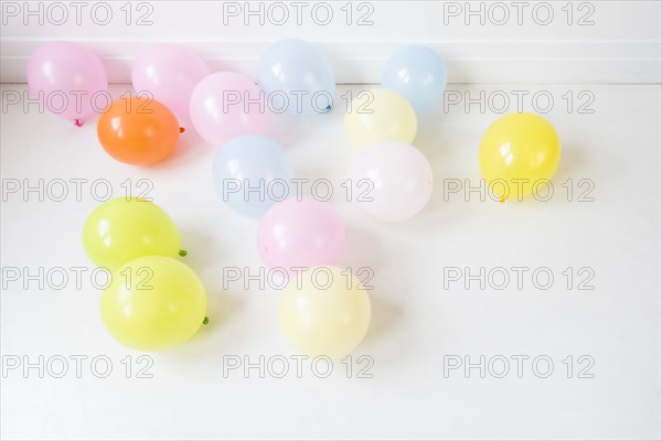 Multicolor balloons on white floor