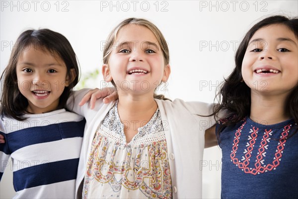 Portrait of smiling girls hugging