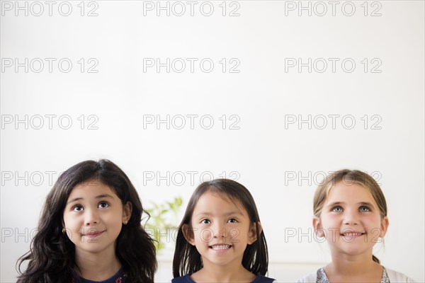Portrait of smiling girls looking up