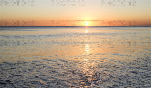 Sunset on ocean horizon