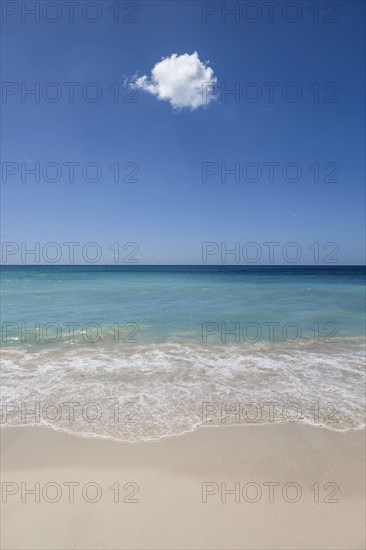 Cloud in blue sky over ocean beach