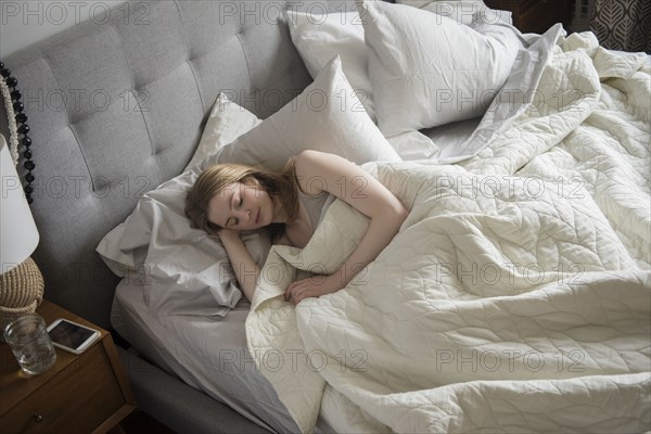 Woman sleeping in bed