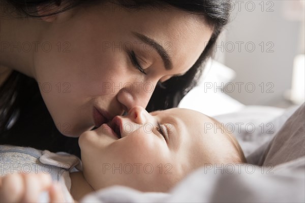 Close up of Caucasian mother kissing baby son