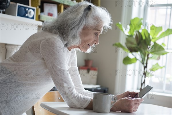 Older woman texting on cell phone