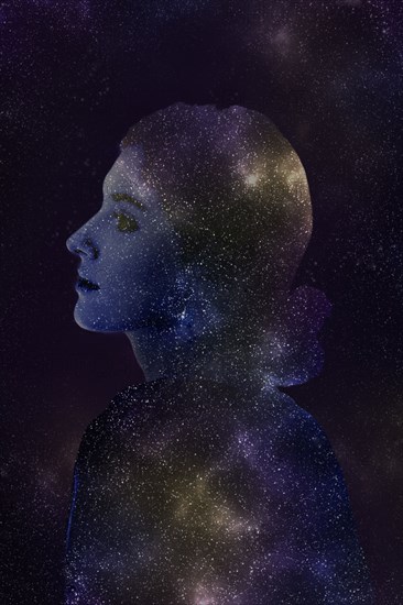 Double exposure of Caucasian woman and stars in outer space