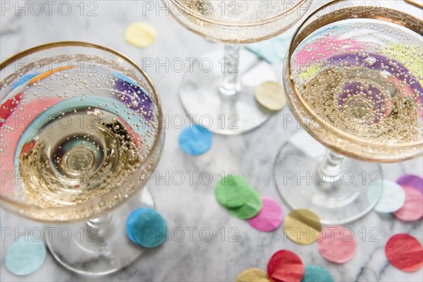 Confetti near glasses of champagne