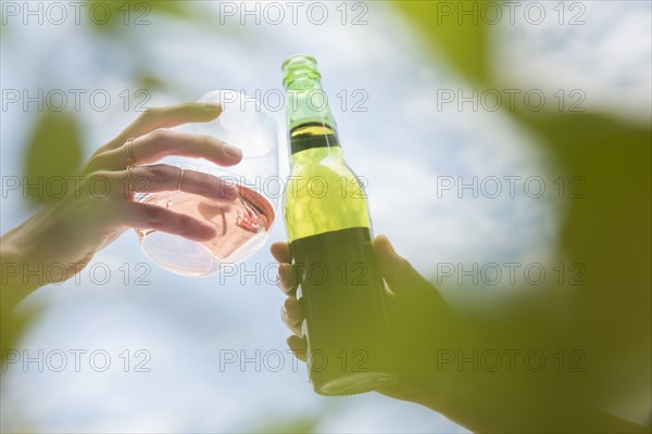 Women toasting with beer and wine