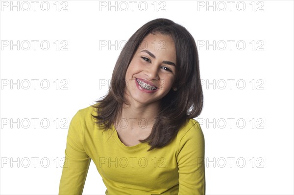 Smiling mixed race teenager with braces