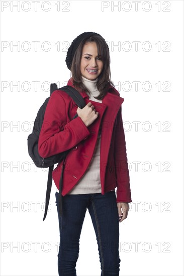 Mixed race teenager carrying backpack